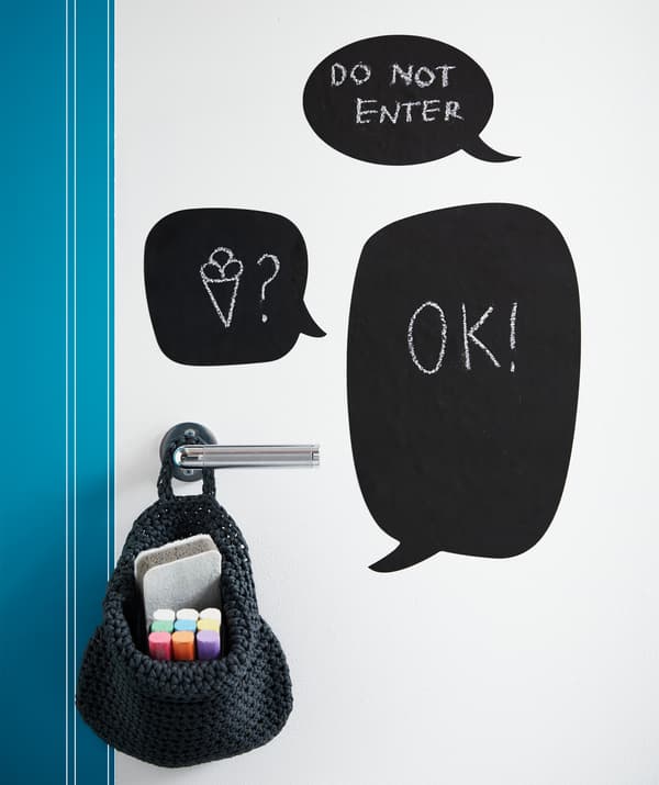 Black KLÄTTA erasable deco stickers in various shapes on a bedroom door