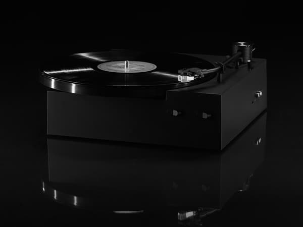 Black record player on black background 