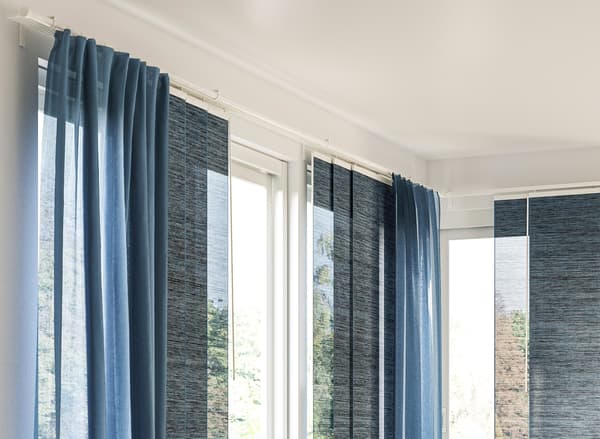 blue curtains and panel curtains on a VIDGA track system