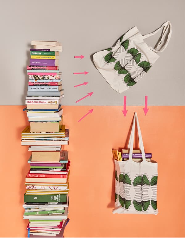 Books being packed into a fabric bag.