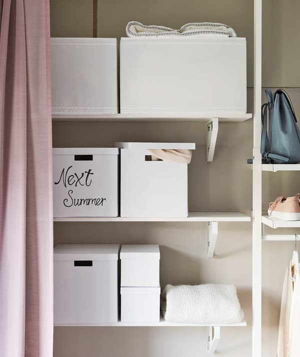 Boxing your out-of-season clothes is an easy way to free up wardrobe space.