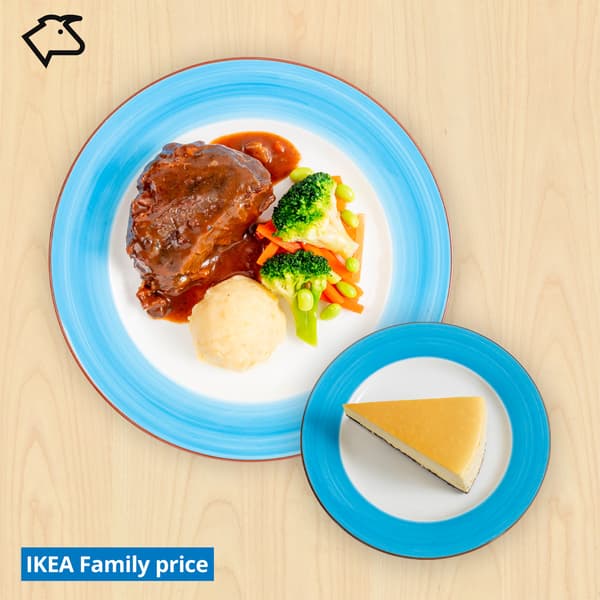 Braised beef cheeks with mashed potato and mixed vegetables & a slice of cheesecake with 'IKEA Family price' tag on the bottom left.