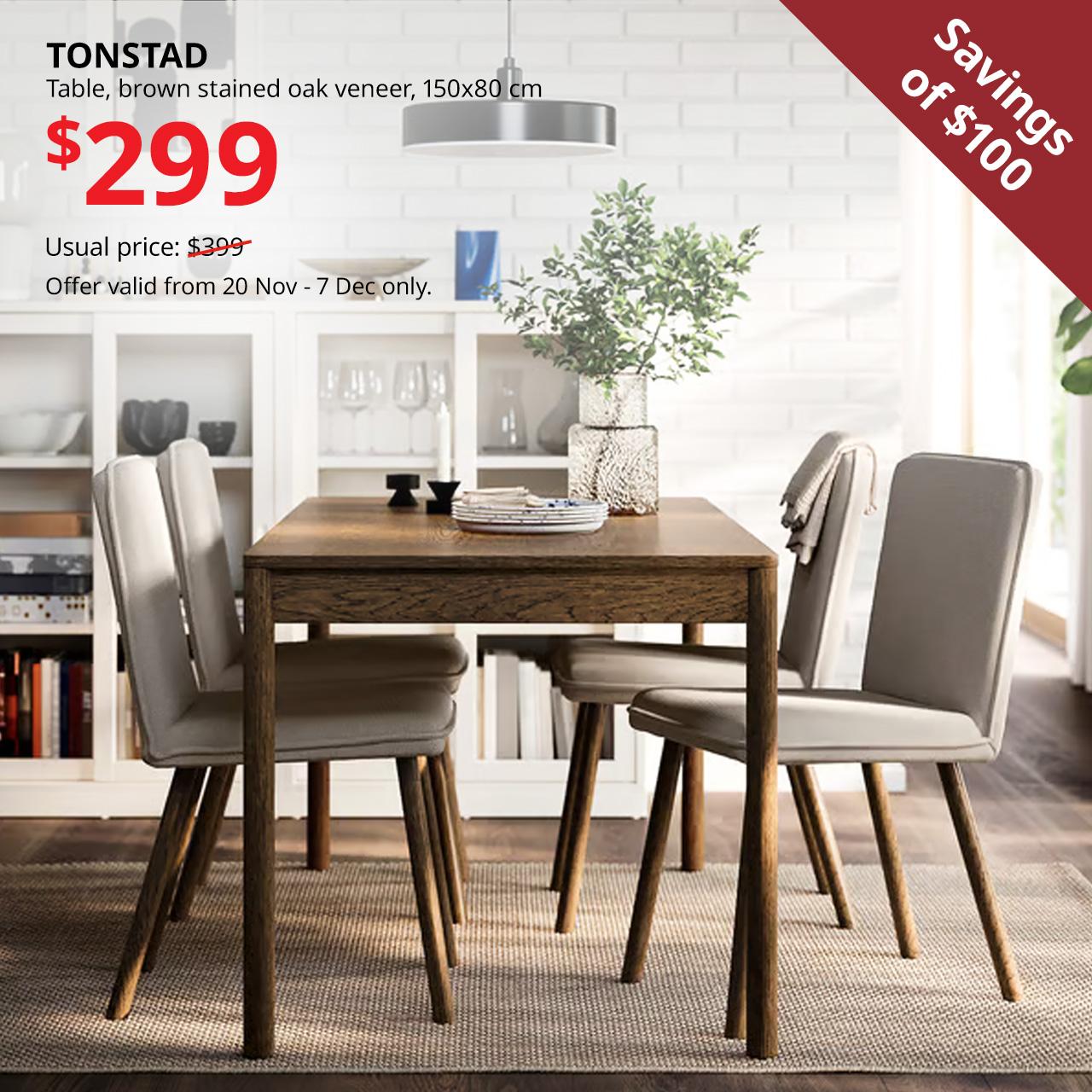 Brown stained oak veneer TONSTAD dining table in dining room with TONSTAD dining chairs. $299