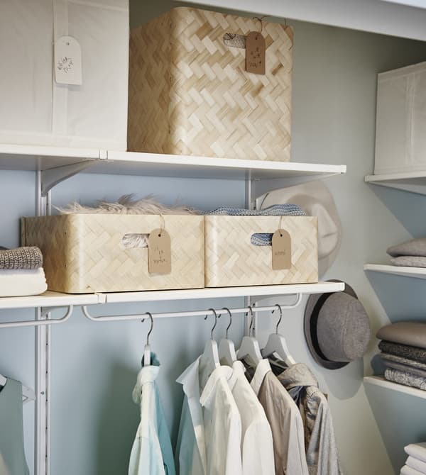BULLIG bamboo boxes in two different sizes on adjustable shelves with clothes rails underneath.