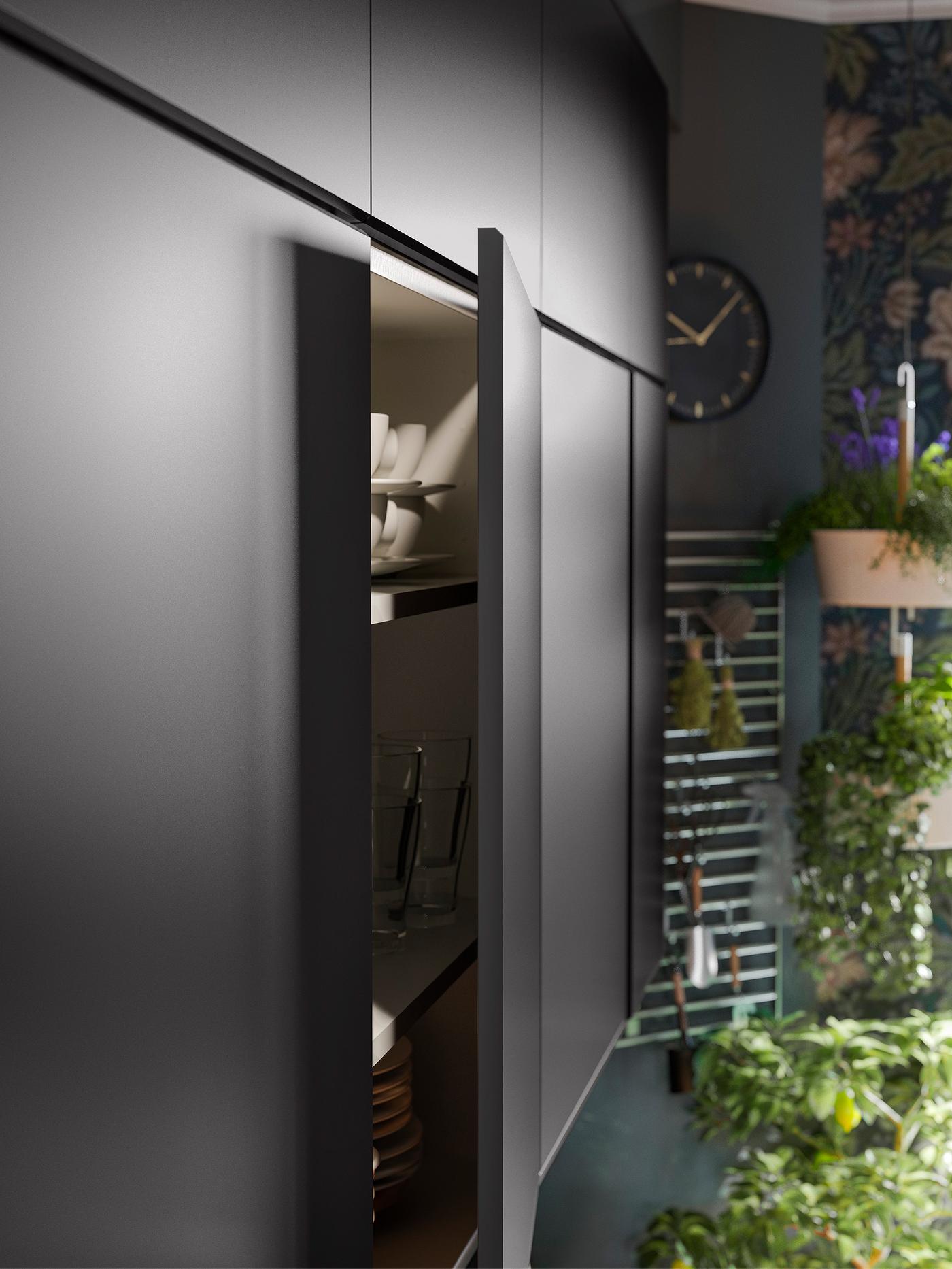 Cabinets with KUNGSBACKA anthracite kitchen cabinet door fronts. One door is open showing tableware stored inside.