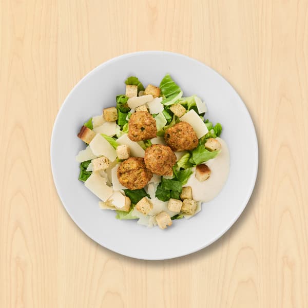 Cæsarsalat med falafel
Romainesalat, falafel, grana padano, croutoner og cæsardressing

49.-