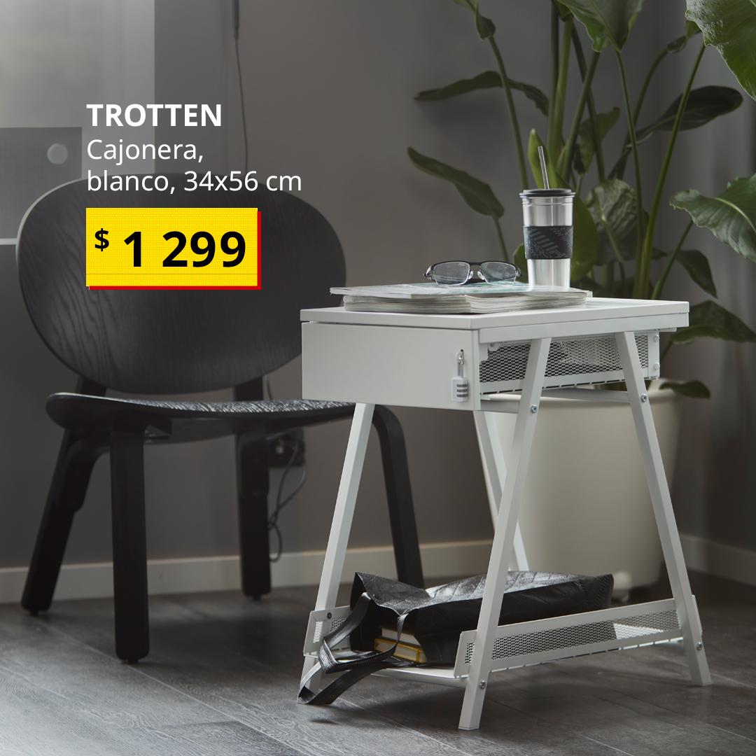 Cajonera TROTTEN blanca con almacenamiento para documentos y esenciales de trabajo, junto a una silla en un espacio de trabajo en casa.