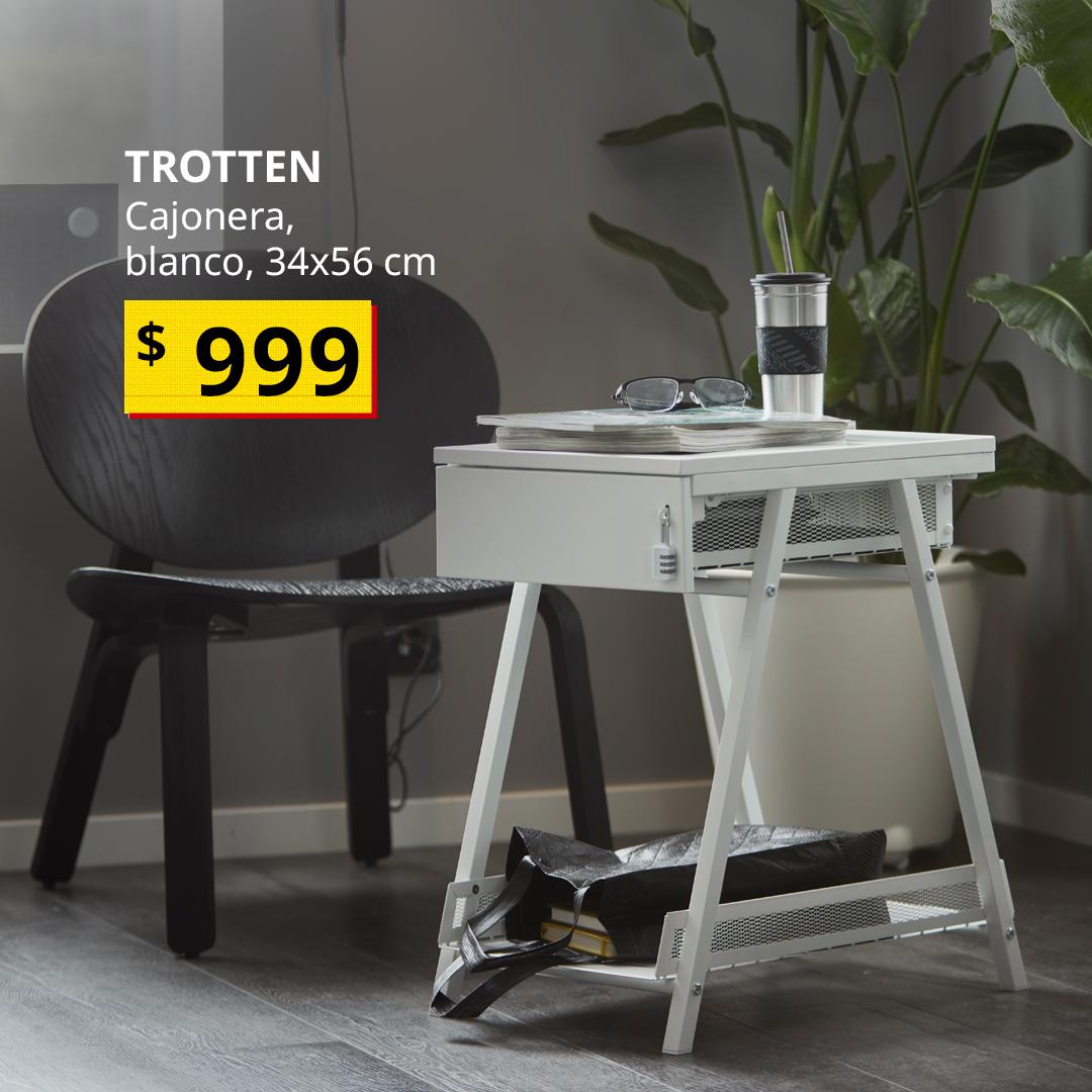 Cajonera TROTTEN blanca con almacenamiento para documentos y esenciales de trabajo, junto a una silla en un espacio de trabajo en casa.