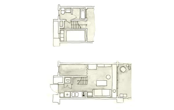 Camera da letto in grigio e bianco con contenitori in legno.