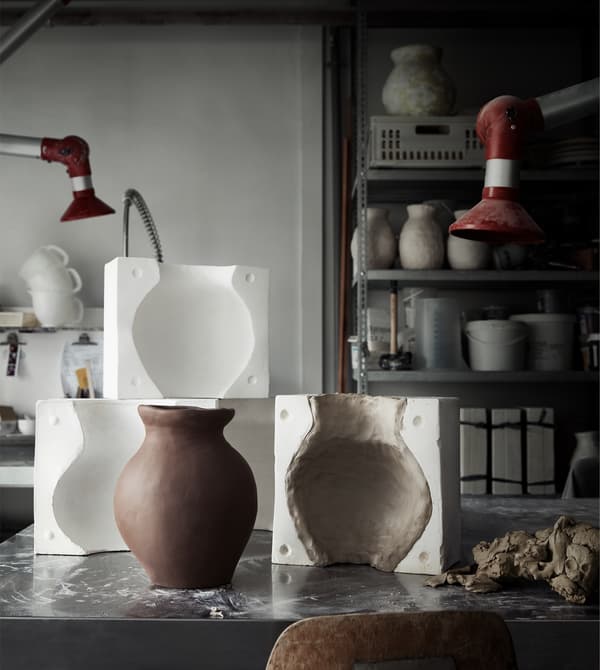 Ceramic vases and moulds in a workshop.
