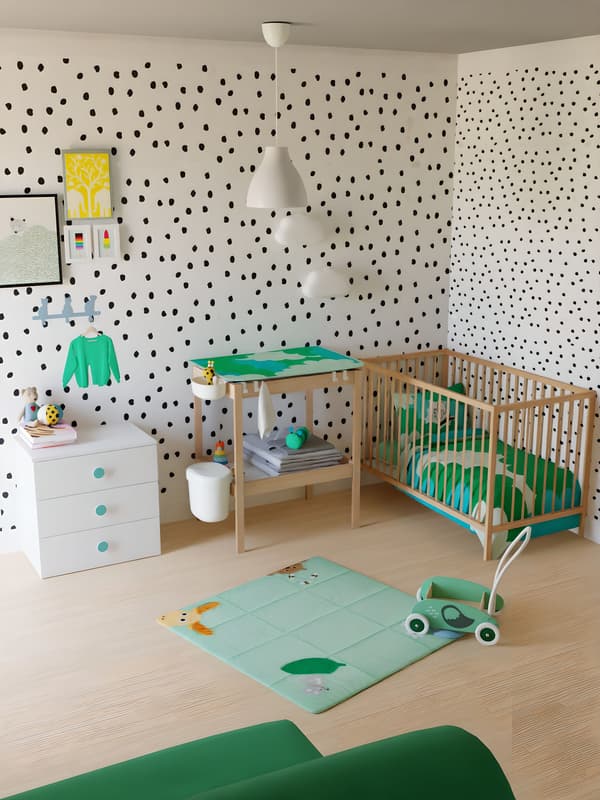 chambre bébé avec des pois aux mur