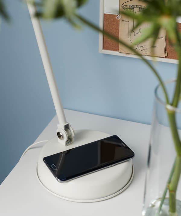 Charge your tech gadgets on a smart lamp. Try IKEA HEKTAR white work lamp with wireless charging! Just put your phone on the lamp’s base.