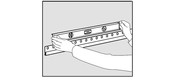 Checking the horizontality of the IKEA finishing rail.