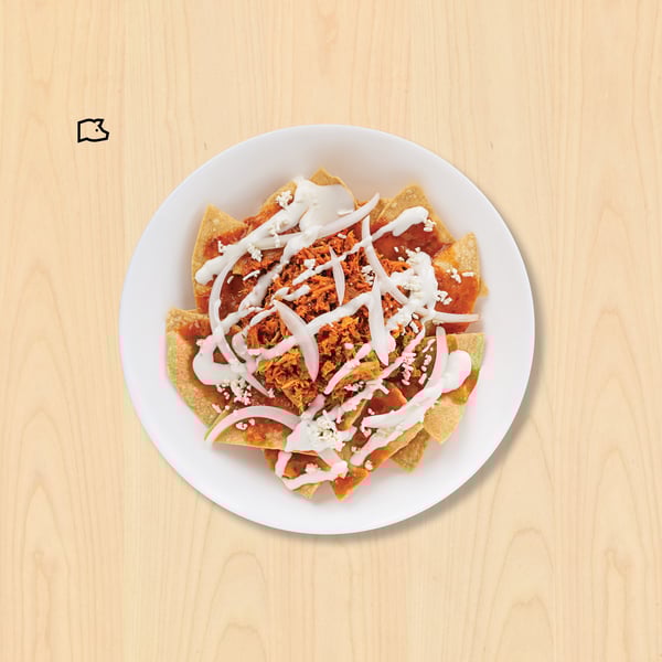 Chilaquiles con cochinita pibil$79Servidos con 80g de cochinita y salsa verde o roja.
