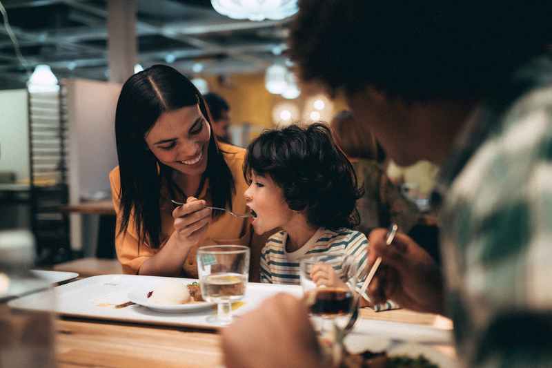 child eating at restaurant