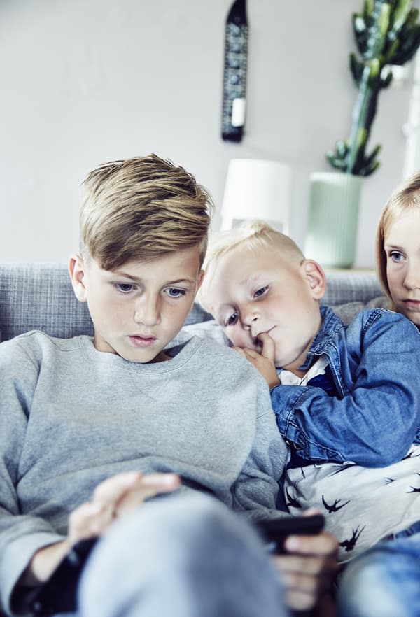 Children looking at a mobile tablet.