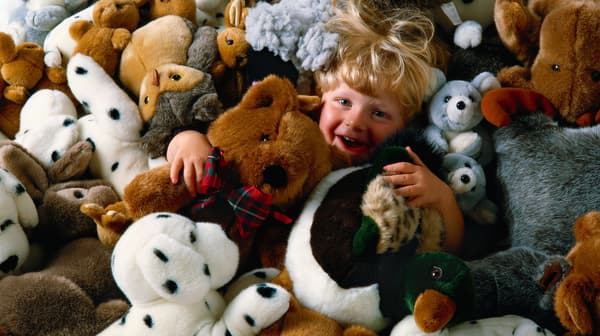 Children playing with soft toy