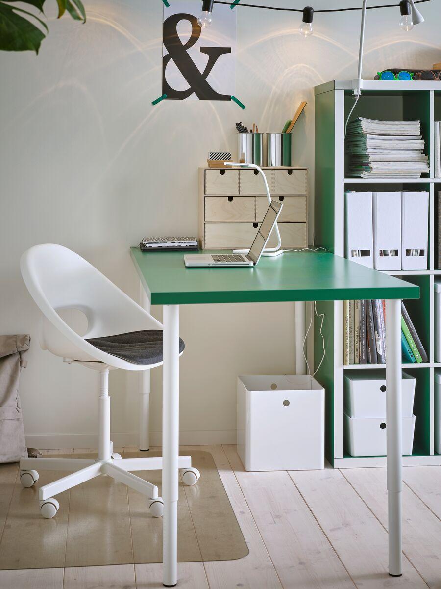 Children's desk chairs
Minimal white children’s desk chair paired with a green and white study table surrounded by storage boxes.