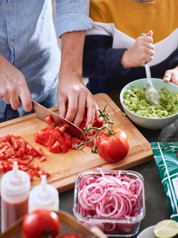 Chopping vegetables on a wooden chopping board