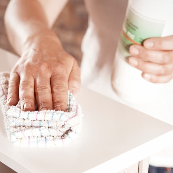 Clean and degrease the drawer fronts.