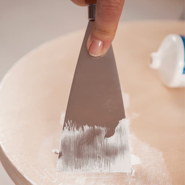 Clean and degrease the wood and fill any scratches with suitable putty.