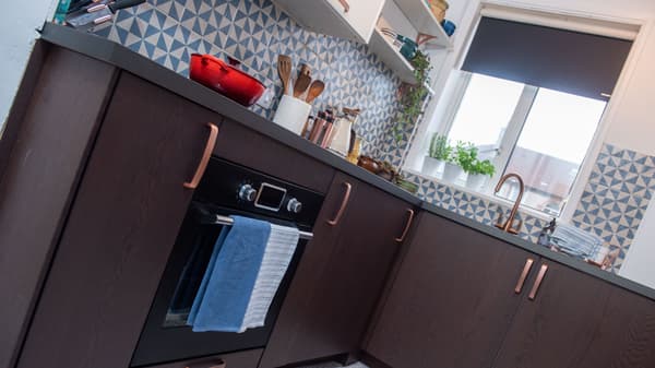 Clever small space solutions with folding chairs and table and tall cabinets