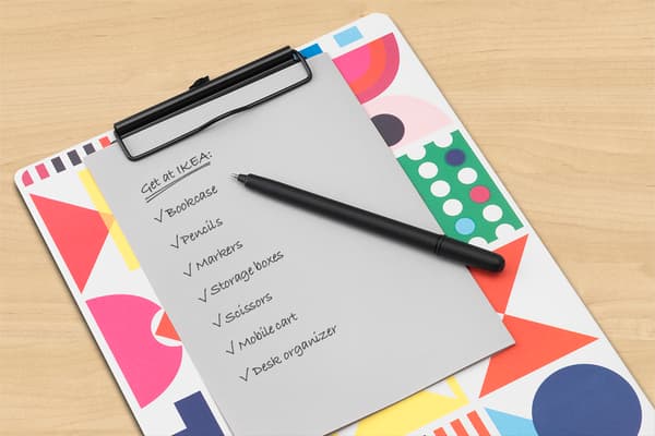 clipboard with check list and pen