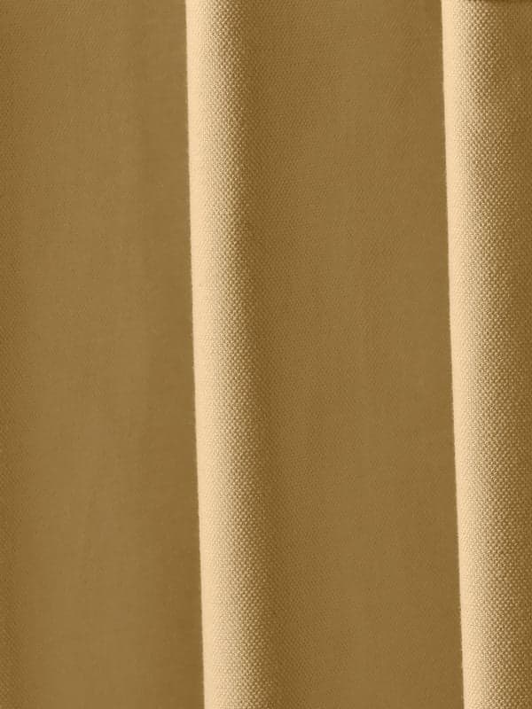 Close-up image of a yellow curtain.