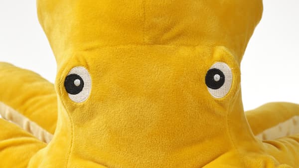 Close-up of a yellow BLAVINGAD octopus soft toy