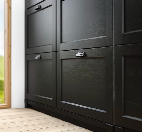 Close up of black shaker LERHYTTAN kitchen fronts with sliver cup handles