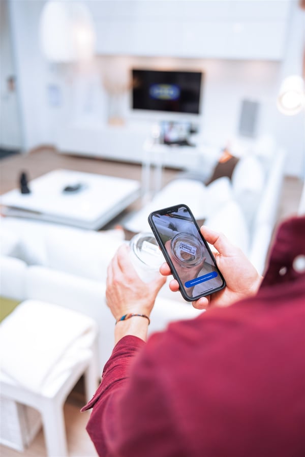 close up of customer scanning IKEA product using Mobile Checkout feature