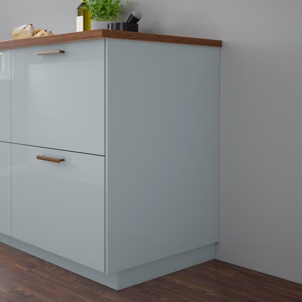 Close up of lower cabinet drawers with KALLARP high-gloss light grey-blue kitchen fronts