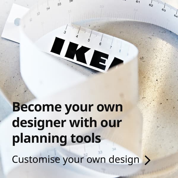 Close-up shot of an IKEA measuring tape made of paper. Text reads: Become your own designer with our palnning tools. Customise your own design >