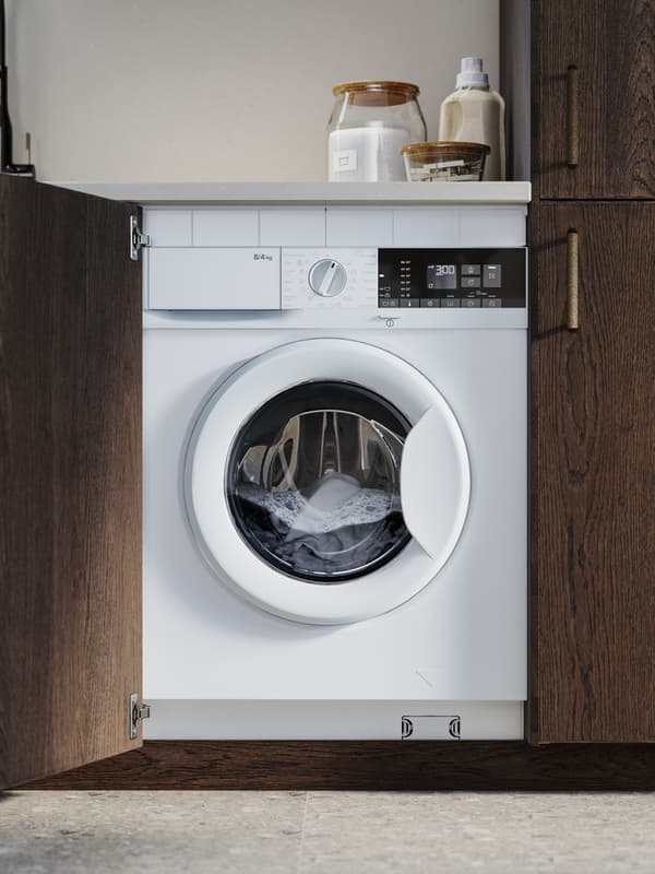 Closed washing machine with clothes inside