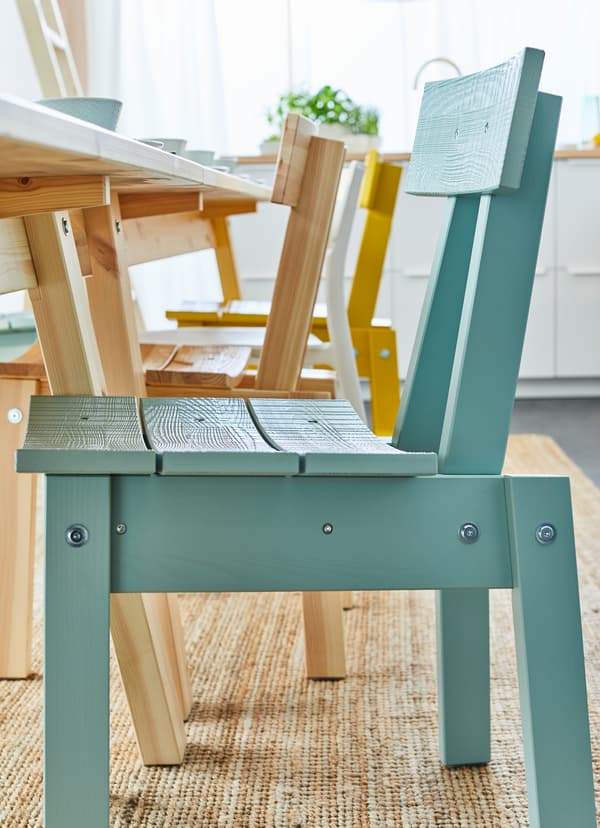 Closeup of an IKEA INDUSTRIELL blue chair.