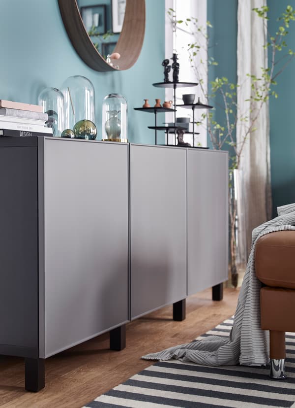 Closeup of IKEA BESTÅ smooth dark grey storage units.