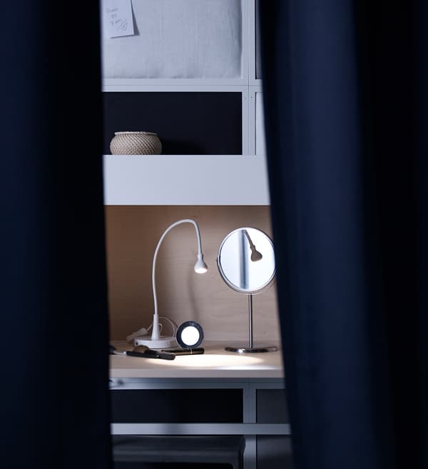 Clothes are much easier to find in the dark in this illuminated wardrobe. A mirror with clothes ready and hanging for the day a head makes getting dressed in the dark in this bedroom even easier.