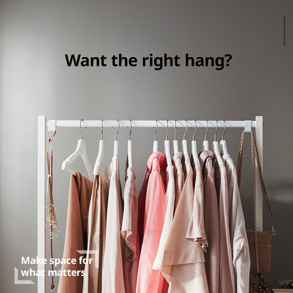 Clothes rack with neatly arranged neutral and pink garments against a gray wall. Text above reads, “Want the right hang?” Text below: “Make space for what matters.”