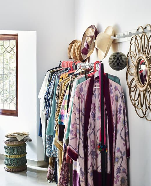Clothes rails hung with colourful clothes.