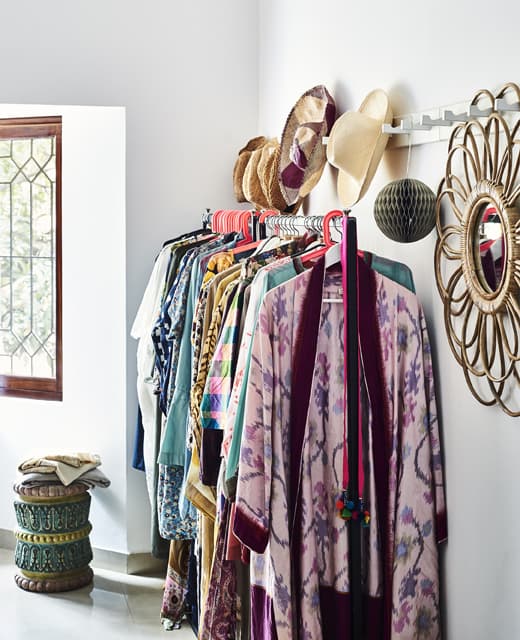 Clothes rails storing colourful clothes.