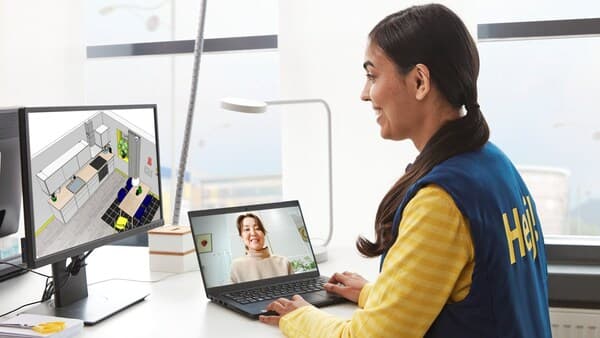 Co-worker is having online meeting and planning kitchen.