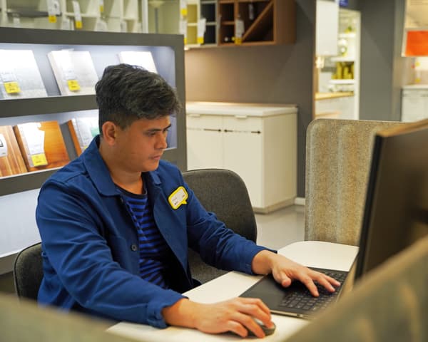 Co-worker planning and designing customer's space