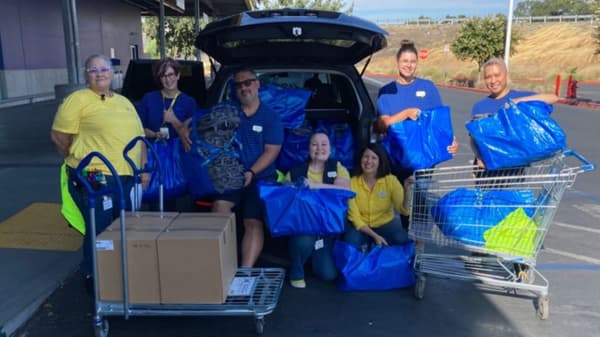co-workers with donated items
