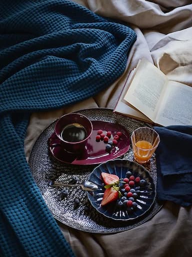 Coffee and breakfast in bed served on a tray.