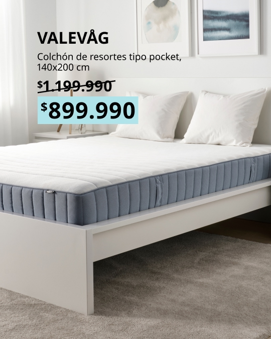 Colchón de resortes embolsados VALEVÅG de 140x200 cm, firme, con funda en color azul claro.