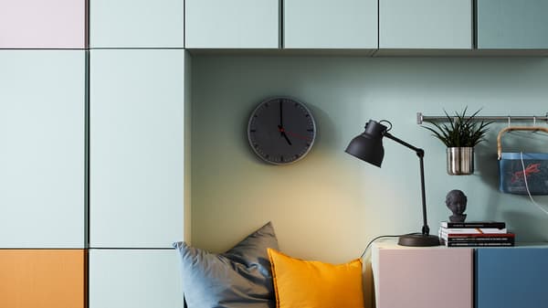 Color-coded IVAR storage units on a wall, including orange, white, blue and pink.