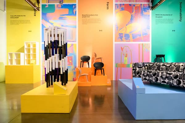 Colorful area at the IKEA Festival featuring iconic IKEA furniture pieces like a sofa and side tables.