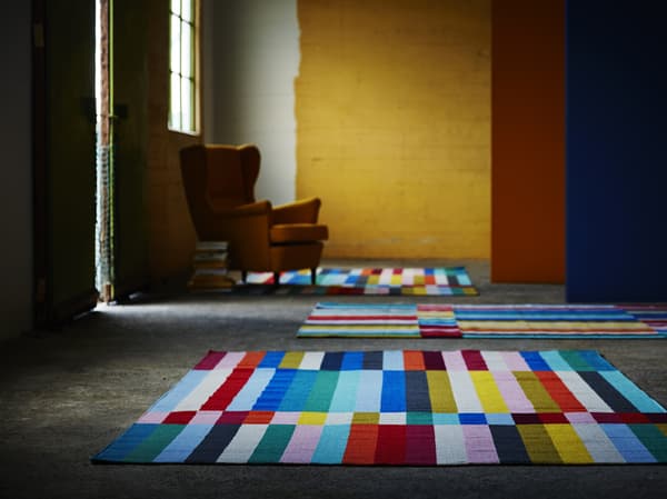 Colorful HALVED rugs spread out on the floor