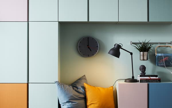 Colour-coded IVAR storage units on a wall, including orange, white, blue and pink.