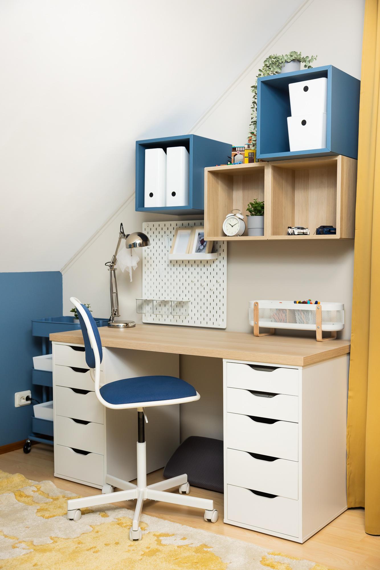 Compact study area with a desk, storage units and shelving, designed to support productive work and learning in a small space.